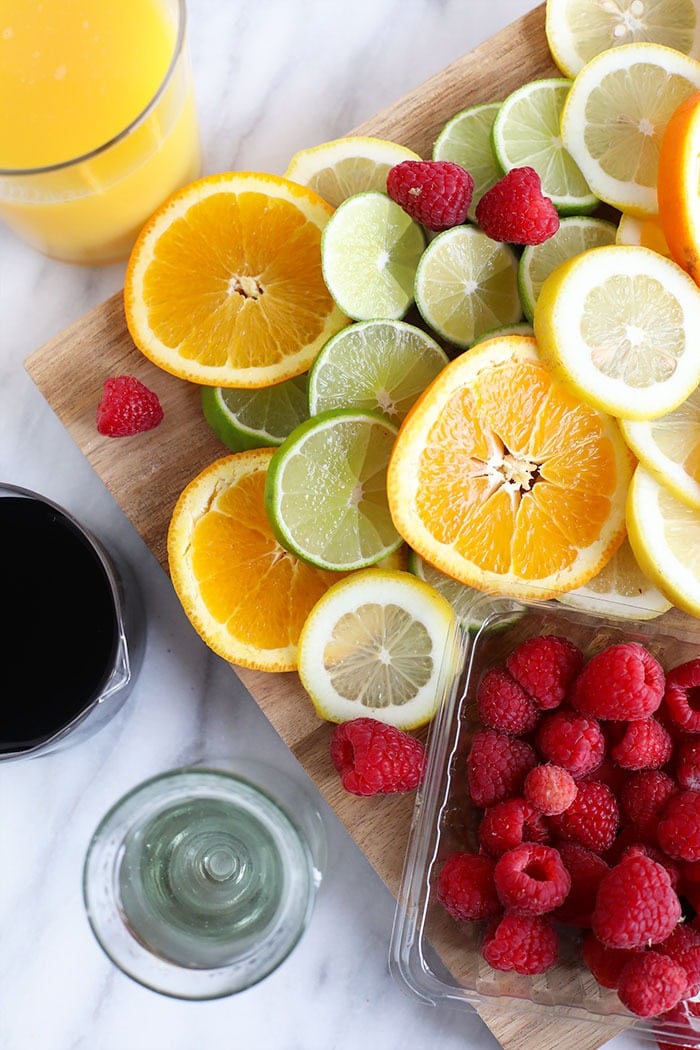 We're sharing an easy sangria recipe that you are going to love! Red wine sangria is made with your favorite Spanish red, orange juice, rum, and tons of sliced citrus. best sangria fruit