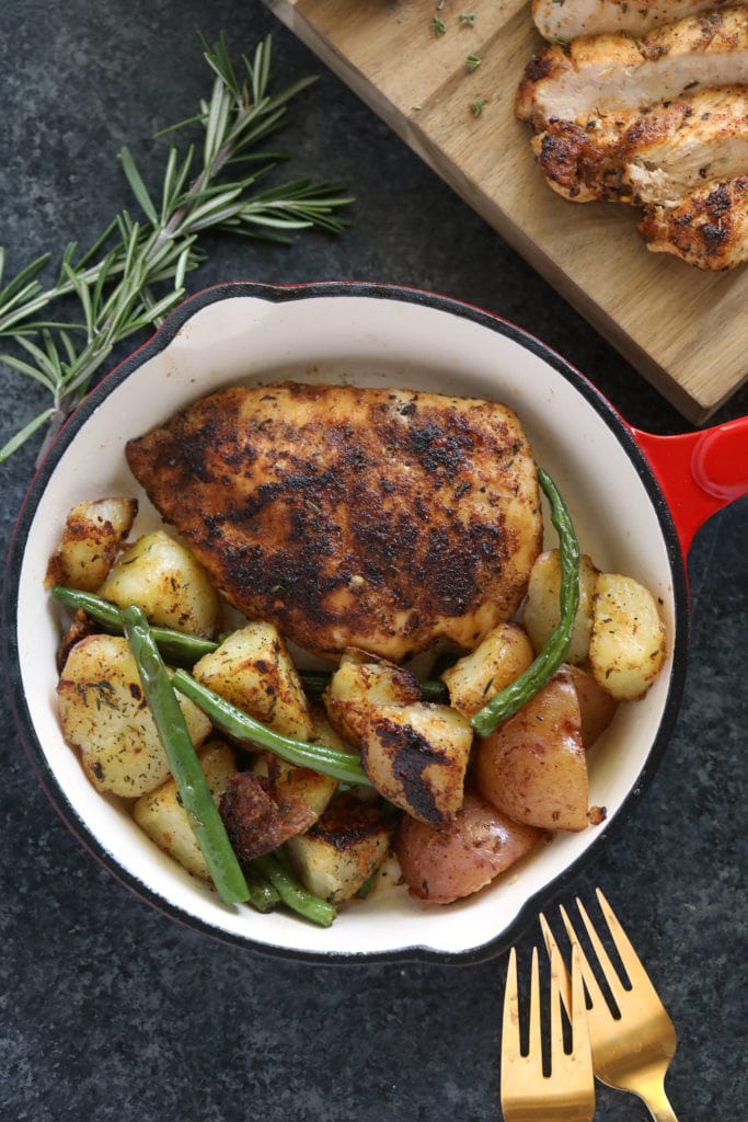 Make this flavorful stovetop chicken breast recipe and pair it with your favorite veggie and grain to complete your meal! chicken breast in pan with potatoes