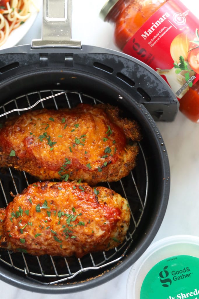 This air fryer chicken parmesan takes no time to whip up and only requires 5 main ingredients. Bonus - there is no oil involved! chicken parmesan in air fryer basket