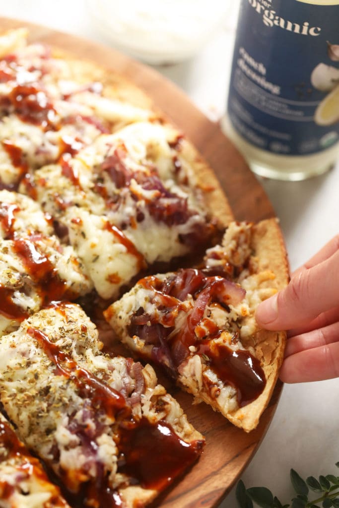 This BBQ chicken pizza with caramelized onions is ready in under 30 minutes and you only need 5 ingredients. It is saucy, flavorful, and makes Friday night pizza night as easy as can be! bbq chicken pizza with bbq sauce