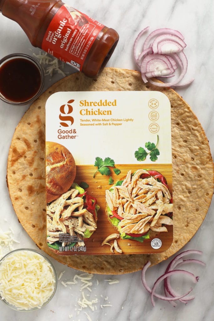 This BBQ chicken pizza with caramelized onions is ready in under 30 minutes and you only need 5 ingredients. It is saucy, flavorful, and makes Friday night pizza night as easy as can be! bbq chicken pizza ingredients