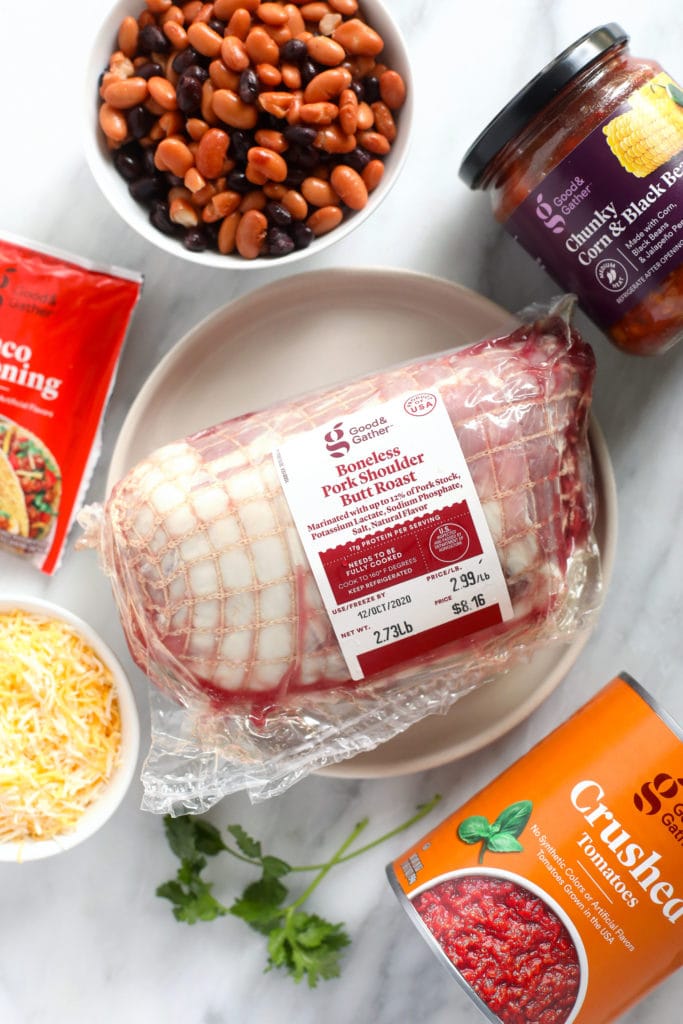 pork shoulder, taco seasoning, cheese, crushed tomatoes, salsa, and beans