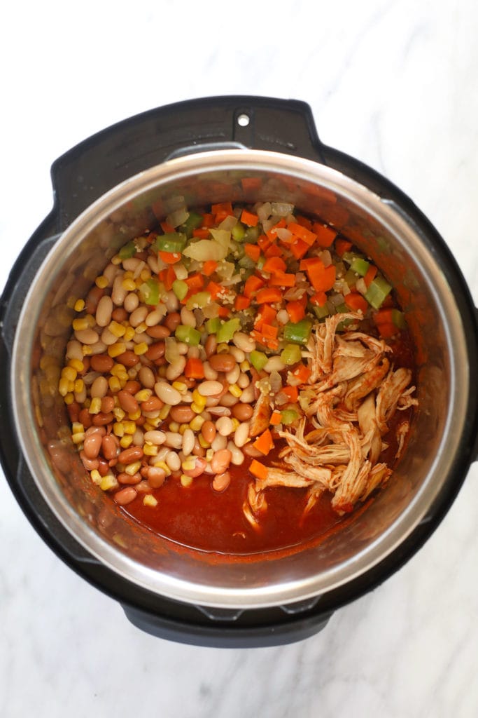 The best buffalo chicken chili recipe on the internet made in your Instant Pot! This buffalo chicken chili is flavorful, packed with veggies, and spicy just...just the way you like it! chili ingredients in instant pot