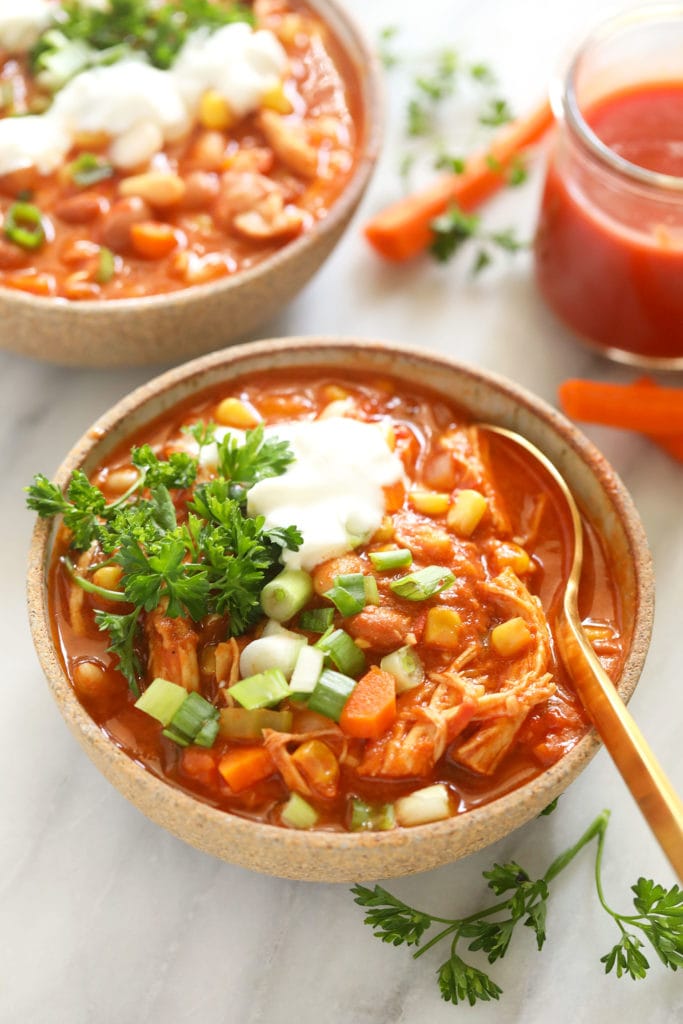 The best buffalo chicken chili recipe on the internet made in your Instant Pot! This buffalo chicken chili is flavorful, packed with veggies, and spicy just...just the way you like it! chili in bowl