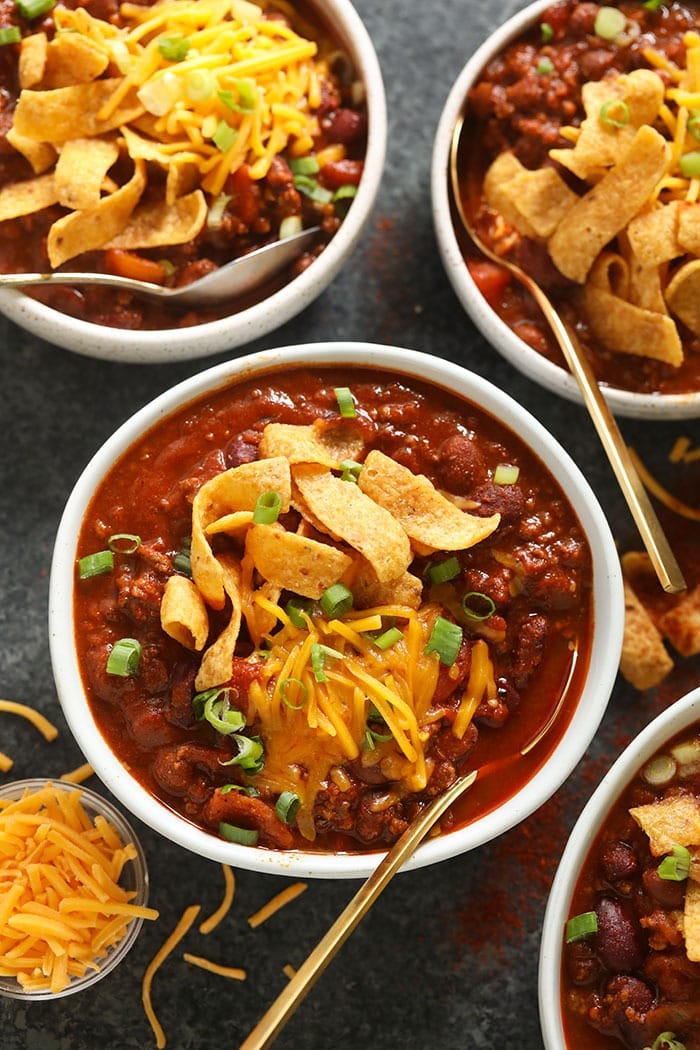 The best chili recipe you'll ever eat is right here! Our classic beef chili is made with ground beef, beans, diced tomatoes, and a homemade chili seasoning. bowl of beef chili with cheese on top