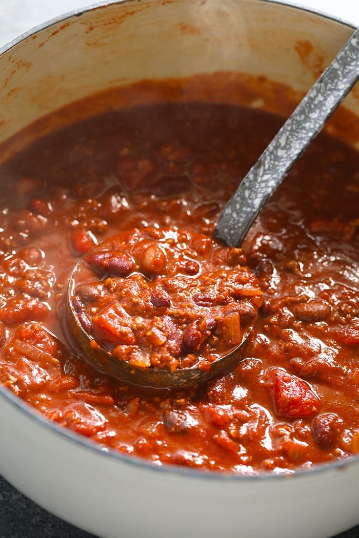 The best chili recipe you'll ever eat is right here! Our beef chili is made with ground beef, beans, diced tomatoes, and DIY chili seasoning. stockpot of the best chili recipe