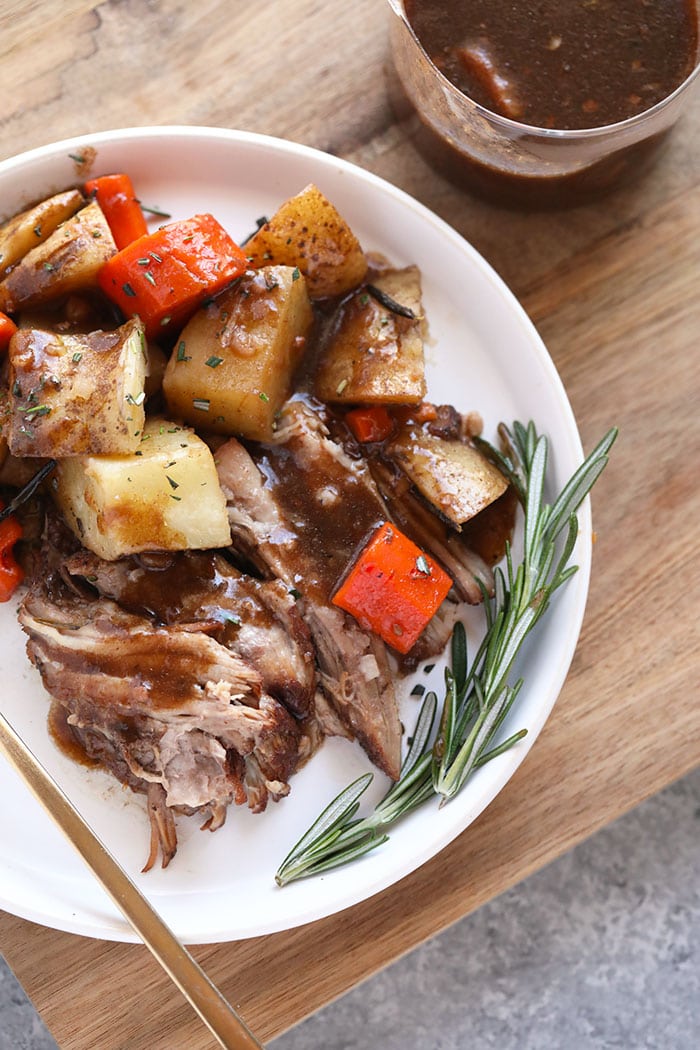 When in doubt, make a pork roast! This Instant Pot Pork Roast recipe has saved the day multiple times when I've been in a pinch. Throw a pork shoulder, carrots, and potatoes in the Instant Pot and you have a healthy homemade meal in only 90 minutes. Did I mention that the pork is tender and falls apart when you cut into it? It's THAT good. Instant Pot Pork roast and vegetables on a plate