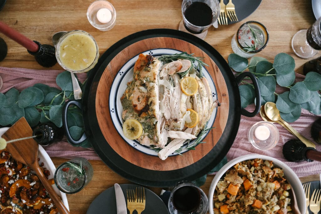 This roasted turkey breast recipe is perfect for a smaller Thanksgiving celebration! It is moist, flavorful, and goes great with any of your favorite Thanksgiving side dishes. ranch turkey breast on table