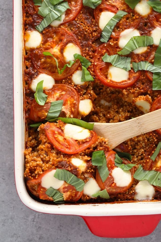 This Tuscan Chicken Quinoa Bake is packed with Italian flavors, kid-friendly, and has a whopping 40g protein per serving! casserole in dish
