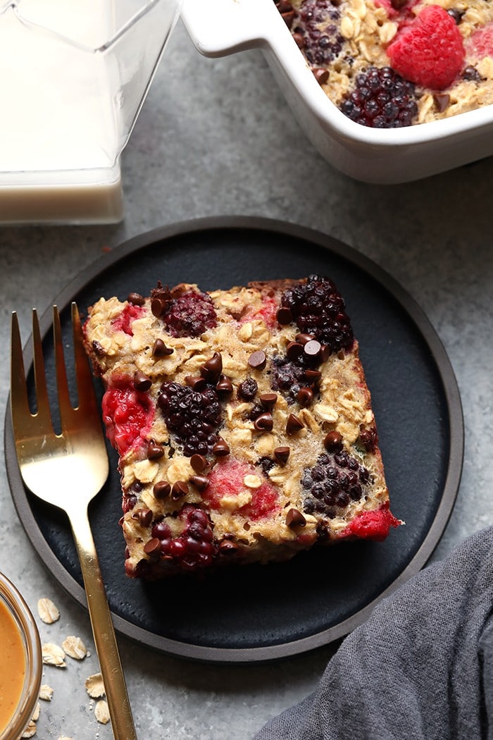 One of our all-time favorite healthy breakfast recipes is this Dark Chocolate Berry Baked Oatmeal. It's sweetened naturally with banana and maple syrup and truly tastes like dessert for breakfast! slice of baked oatmeal