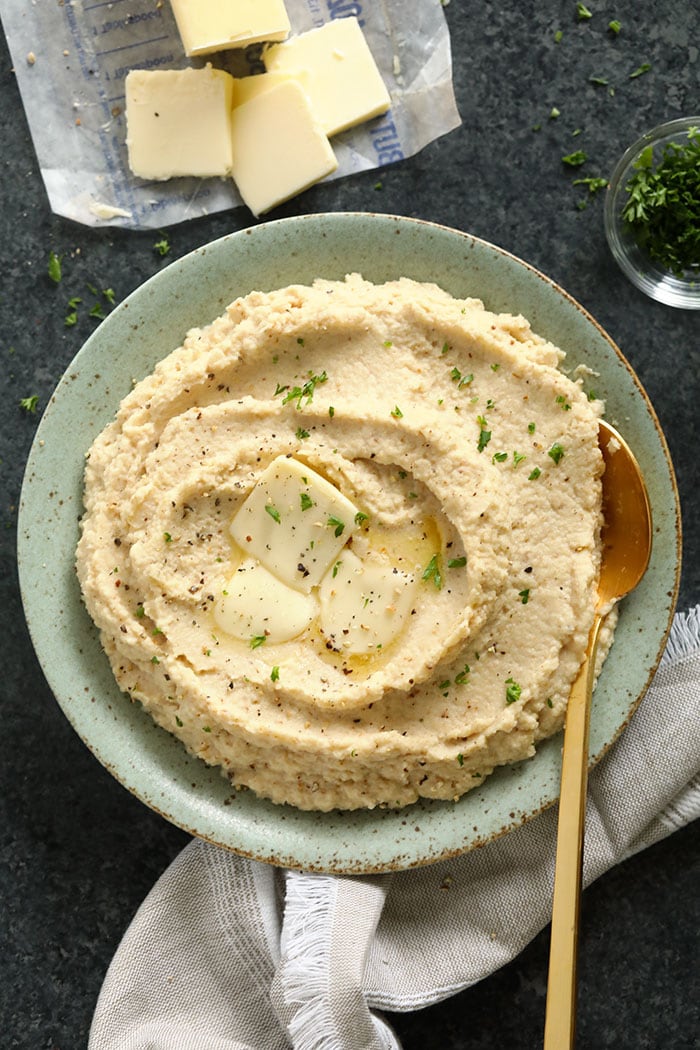 Make these cauliflower mashed potatoes for your next dinner party! They make a great low carb side dish for the holidays! Not only are they healthy, but they are insanely delicious! Cauliflower mash in a bowl
