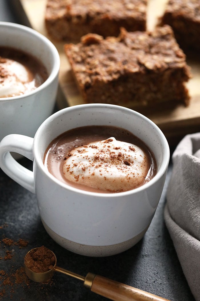 Vegan Chai Hot Chocolate that’s ready to drink in 5 minutes! This delicious vegan hot chocolate is low calorie, creamy and full of chai flavor. Make this homemade chai hot chocolate recipe today! vegan chai hot chocolate in a mug
