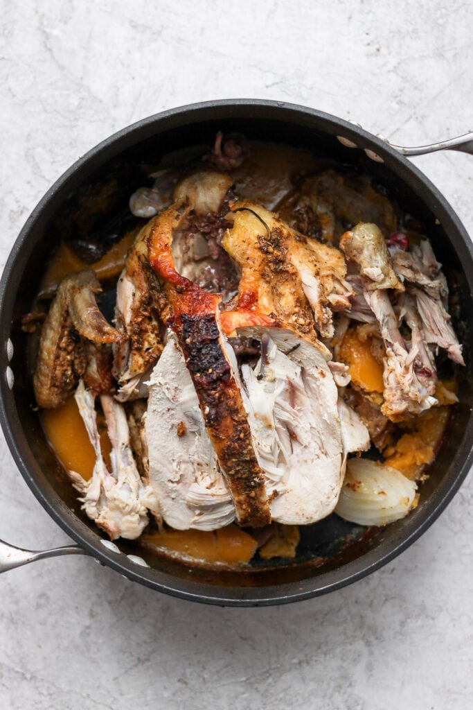 Chicken carcass in a pot.