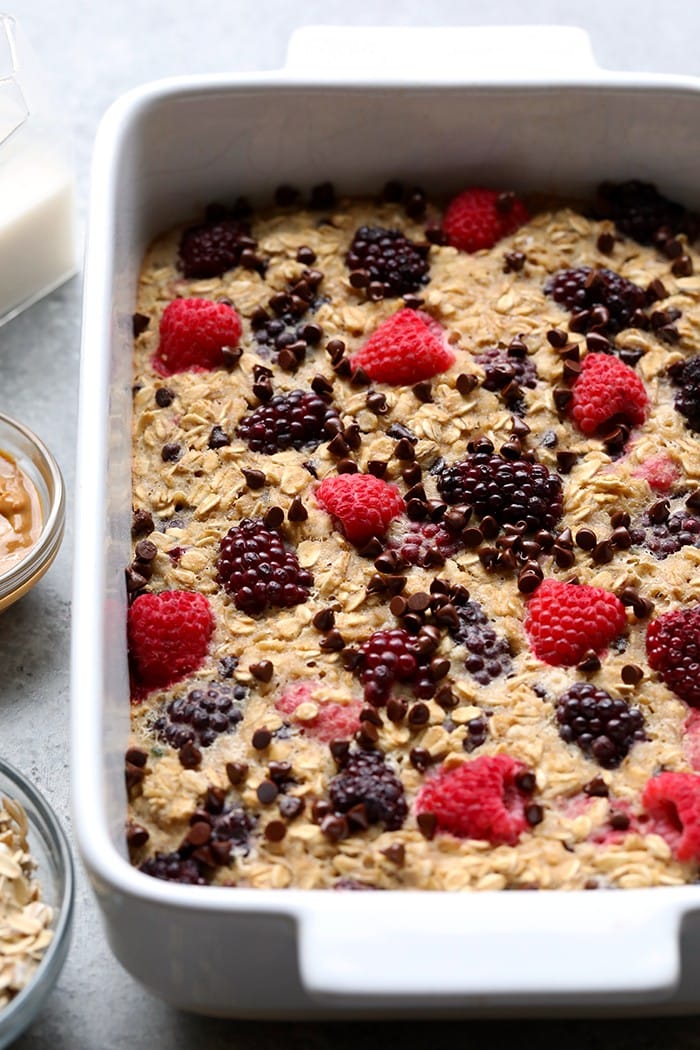 One of our all-time favorite healthy breakfast recipes is this Dark Chocolate Berry Baked Oatmeal. It's sweetened naturally with banana and maple syrup and truly tastes like dessert for breakfast! baked oatmeal in casserole dish