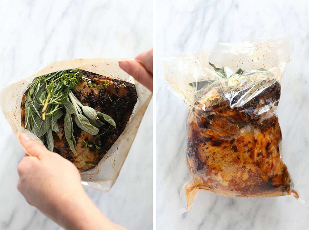 Sous vide turkey in a bag with fresh herbs.