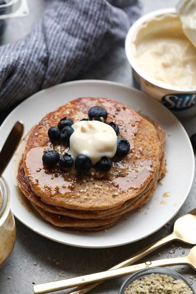 Can’t have eggs or dairy? No problem! Make these amazing Vegan Banana Pancakes. You’ll sub a flax egg for eggs, almond milk for cow’s milk, and soy yogurt for dairy yogurt. vegan pancakes on plate
