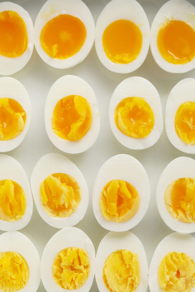 This is the only easy peel hard boiled eggs recipe you'll ever want to use again. In this post, we'll teach you how to hard boil eggs + answer all your questions about cooking hard boiled eggs. hard boiled eggs on plate