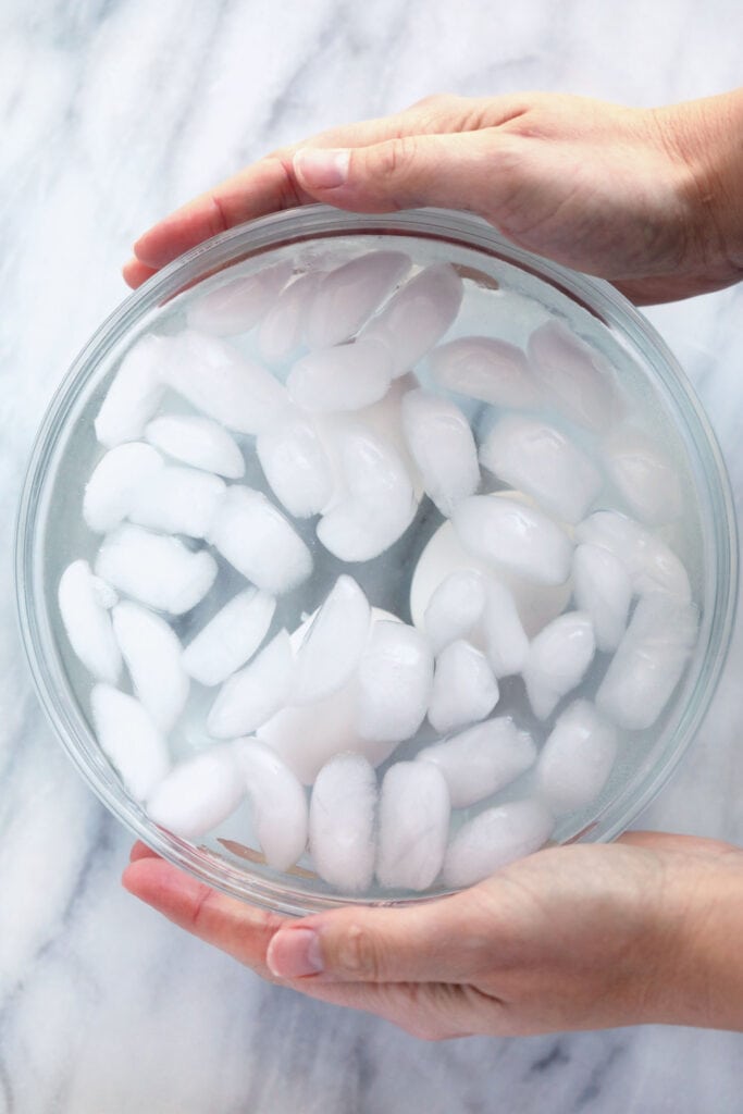 Looking to make PERFECT hard boiled eggs? This hard boiled eggs recipe is foolproof and will get you the exact kind of yolk you want! hard boiled eggs in ice water