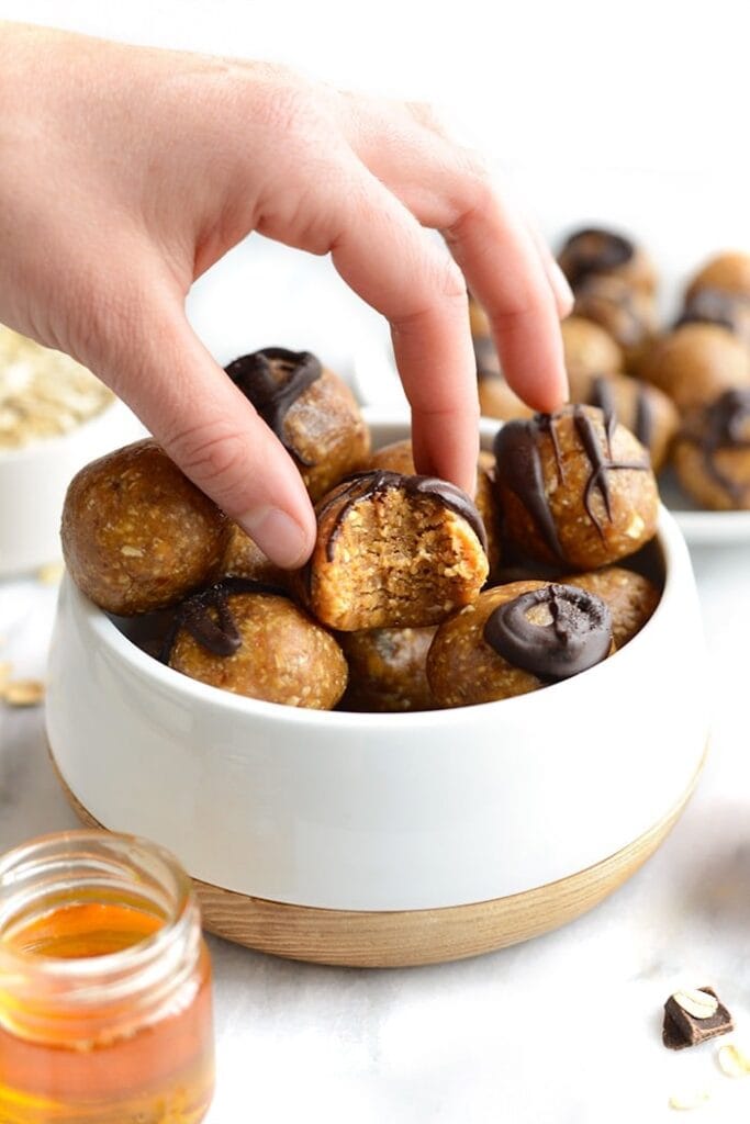 These peanut butter energy balls are everything you’ve ever wanted in a snack. They’re made with real ingredients in less than 10 minutes! So, whip out your food processor and make the best healthy peanut butter balls on the planet.