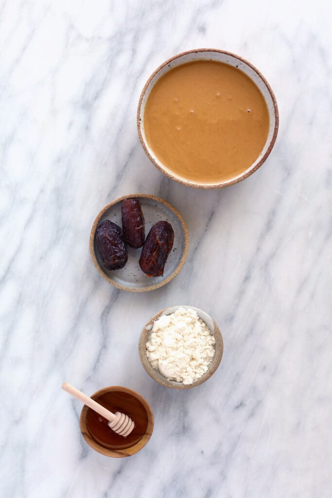 Homemade protein bars are made with simple ingredients such as peanut butter, dates, honey, ground oat flour, and protein powder. ingredients