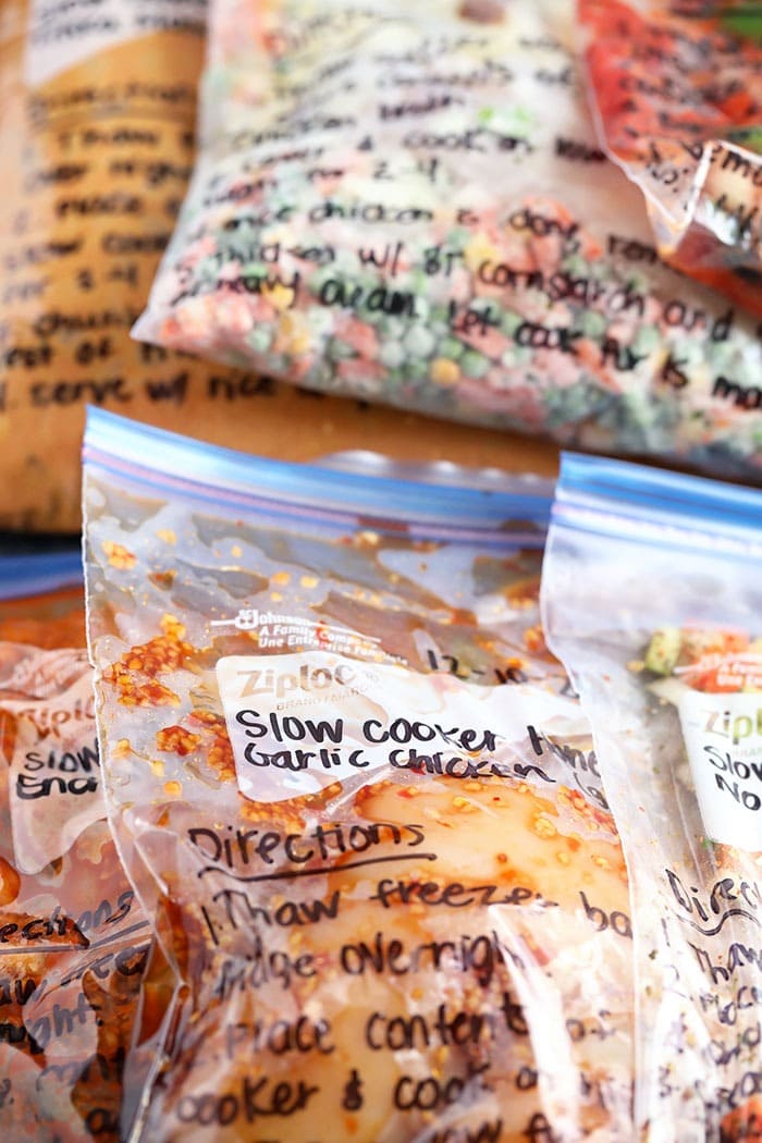 We're sharing 6 Crockpot Freezer Meals with a shopping list and everything you need to know about prepping and cooking these freezer meals. honey garlic chicken in freezer bag
