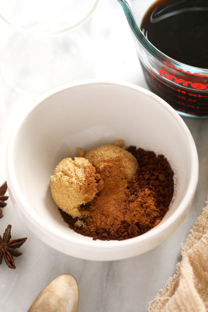 Brown sugar, instant coffee, and pumpkin spice in a bowl.