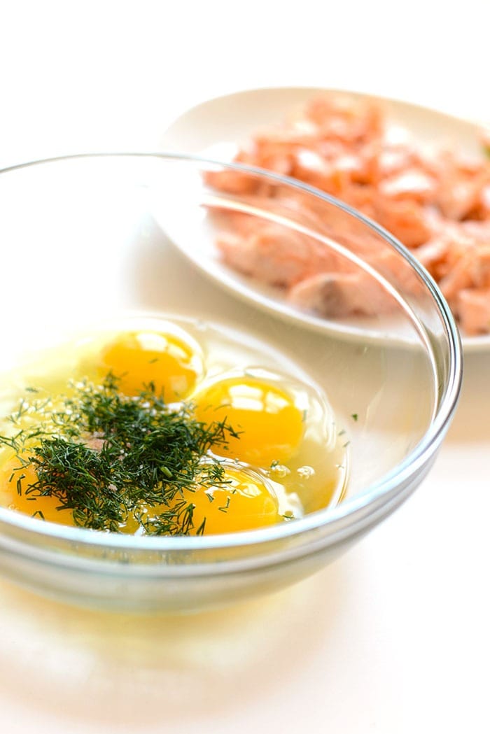 Got leftover salmon? Make this protein-packed dill salmon and eggs scramble that's made with just a few ingredients and seasonal flavors! eggs and dill in bowl