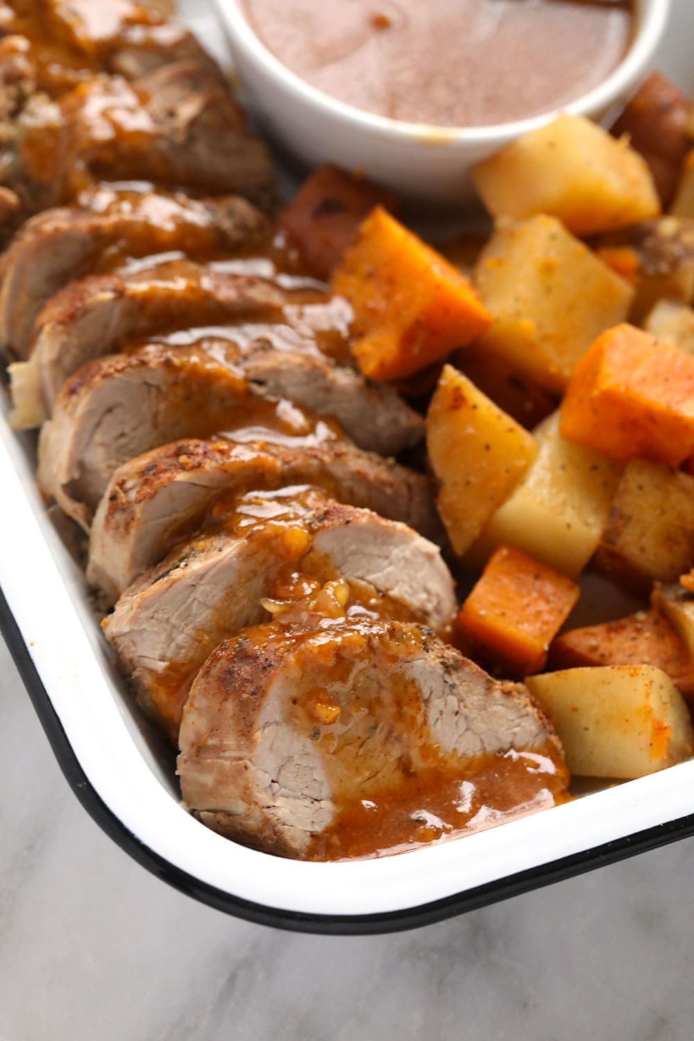 This flavorful and tender Instant Pot Pork Tenderloin is ready in under an hour! It is the perfect easy dinner recipe that the whole family will enjoy. Tenderloin with gravy and potatoes