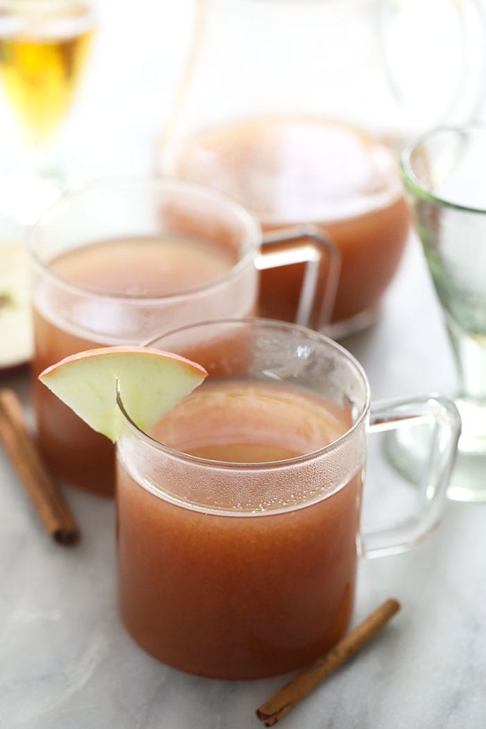 This Spiked Apple Cider is a boozy twist on our traditional apple cider recipe that's been a Fall favorite for years. Make a large batch to serve a crowd, or pour a single serve spiked cider tonight. Cheers! spiked apple cider in a glass mug