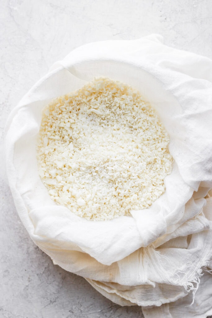 Cauliflower rice in a tea towel.