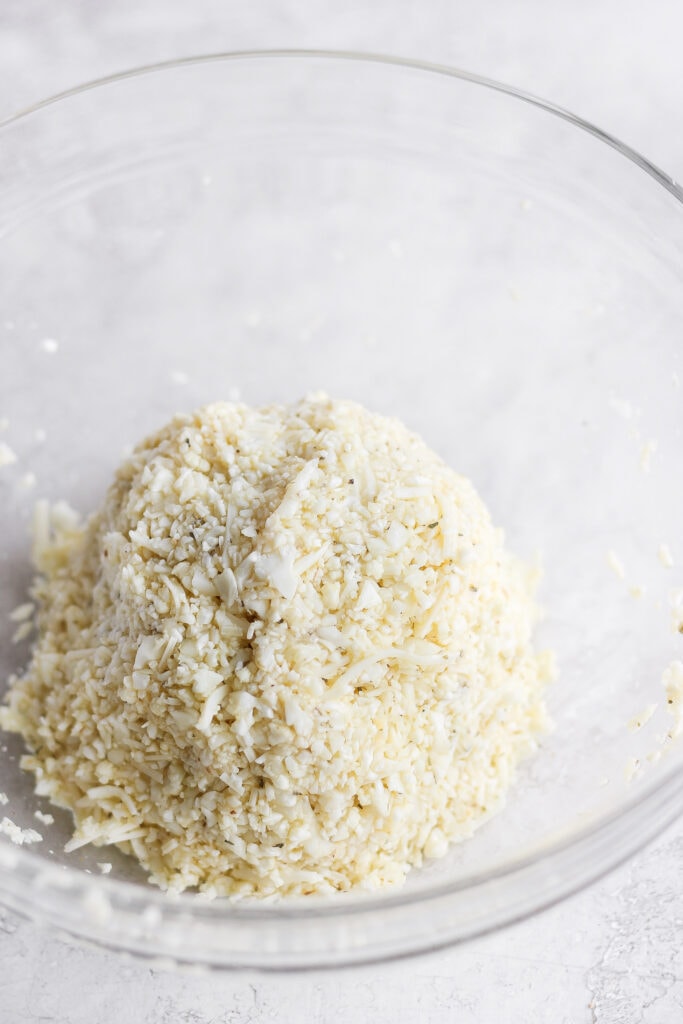 Cauliflower crust ingredients made into a ball.