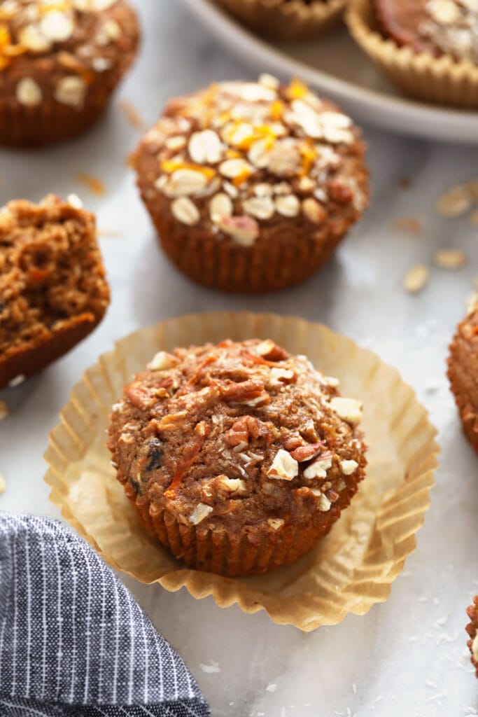 A morning glory muffin with fresh oats on top.