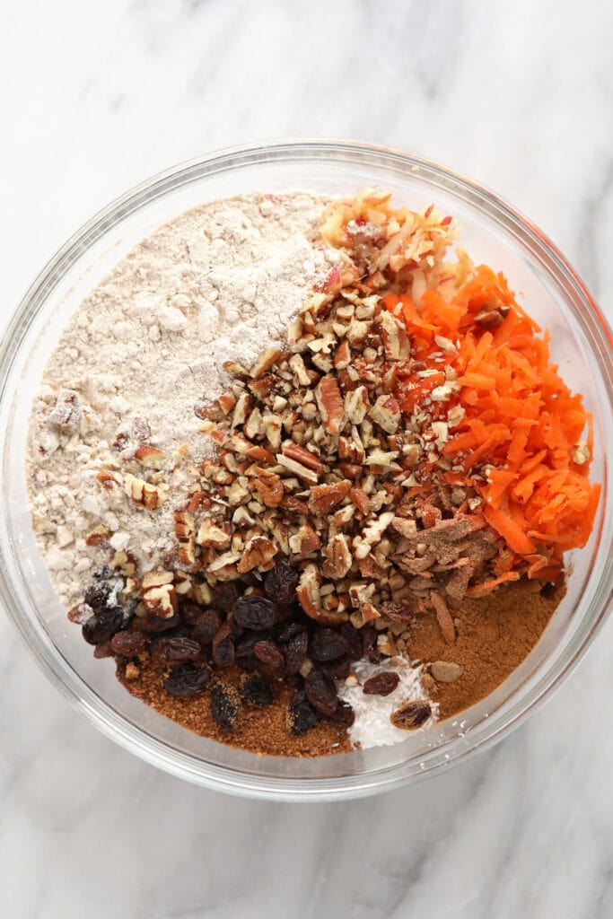 Morning glory muffin ingredients in a bowl.