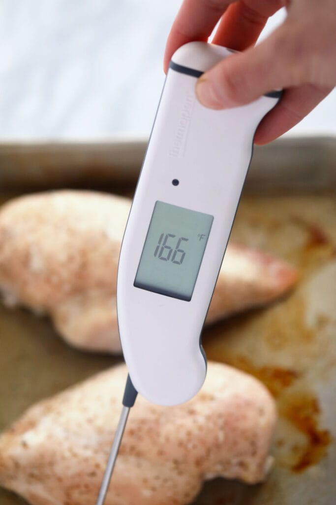 Wondering how to make the easiest shredded chicken? Look no further! This shredded chicken is baked to perfection, and will easily become a meal-prep staple in your home. thermometer in a chicken breast to determine internal temperature