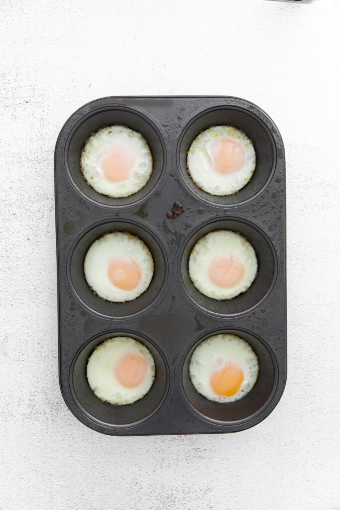 Perfectly cooked baked eggs in a muffin tin! Muffin tin eggs are the best breakfast or snack and can be made ahead of time. baked eggs in muffin tin