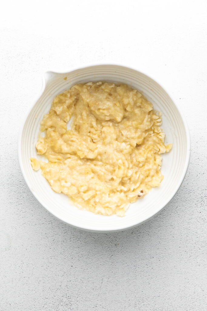 This banana pancake recipe is the ultimate weekend breakfast. Why? These banana pancakes come out super fluffy and they taste heavenly topped with fresh banana and warm maple syrup. mashed banana in bowl