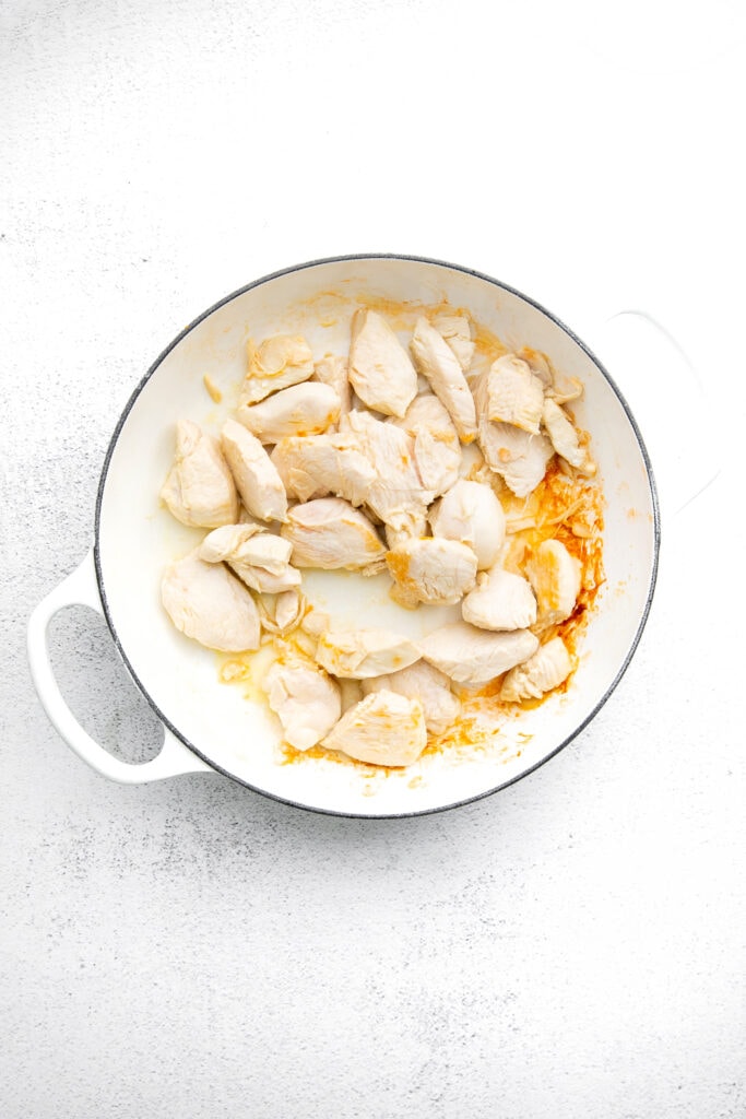 A super simple kung pao chicken recipe that uses easy-to-find ingredients and isn't SUPER spicy. chicken in pan