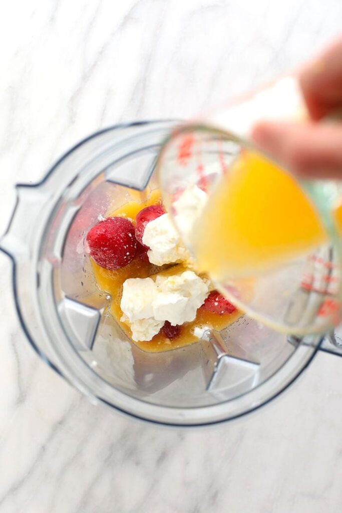 Rise and shine with a delicious Smoothie Bowl. In this post, we'll teach you how to make a smoothie bowl + our top 3 smoothie bowl recipes! smoothie ingredients in blender