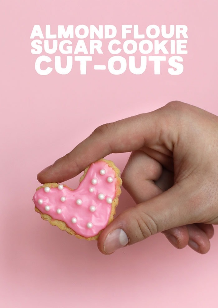 Our healthy sugar cookies are made with the base of almond flour and coconut flour and are sweetened with honey. That's right, no white sugar involved! A sugar cookie with pink frosting and sprinkles