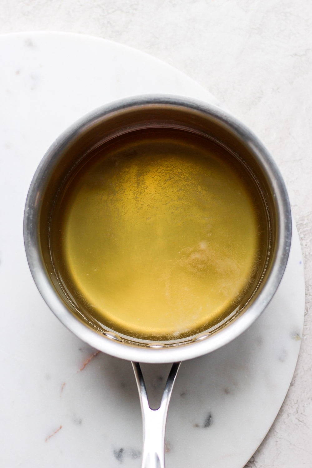 Take your margaritas up a notch! These refreshing blood orange margaritas are easy to mix up for two or mixed up in a pitcher margaritas for a crowd. All you need is fresh blood orange juice, simple syrup, lime juice, and tequila! Simple Syrup in a small pot