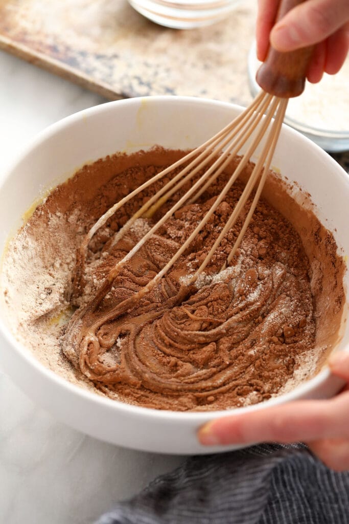Ooey-gooey homemade fudgy brownies made with simple ingredients. You'll never want to eat another fudgy brownie recipe again! whisking together flour and cocoa powder