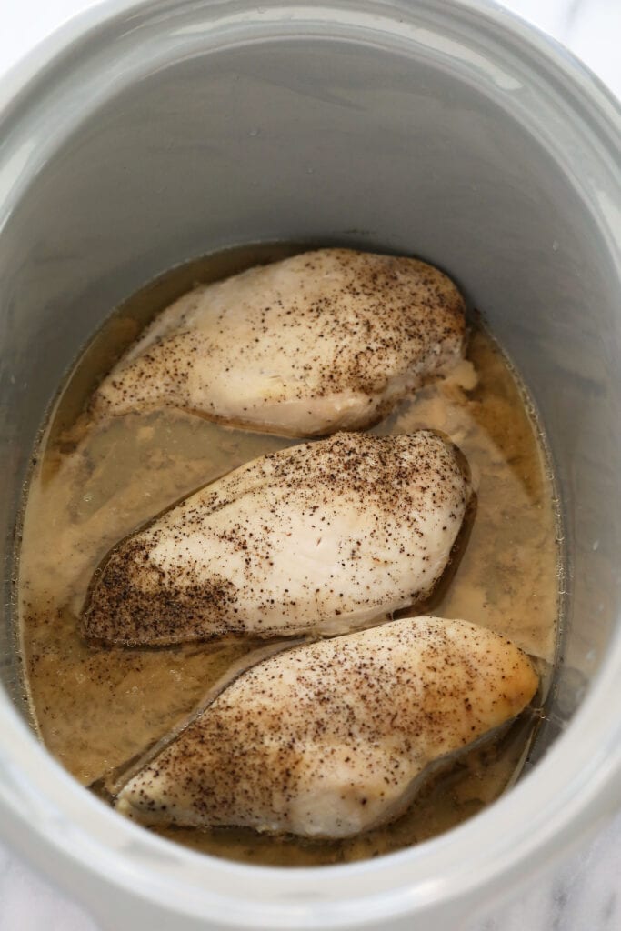 Crockpot shredded chicken is the easiest method for making shredded chicken. It's a set it and forget it kind of shredded chicken that's hands-off and straightforward. cooked chicken in slow cooker
