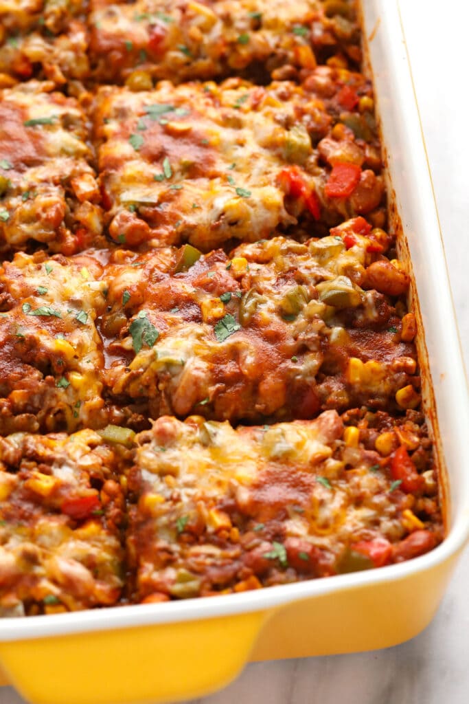 Baked Mexican casserole sliced into pieces.