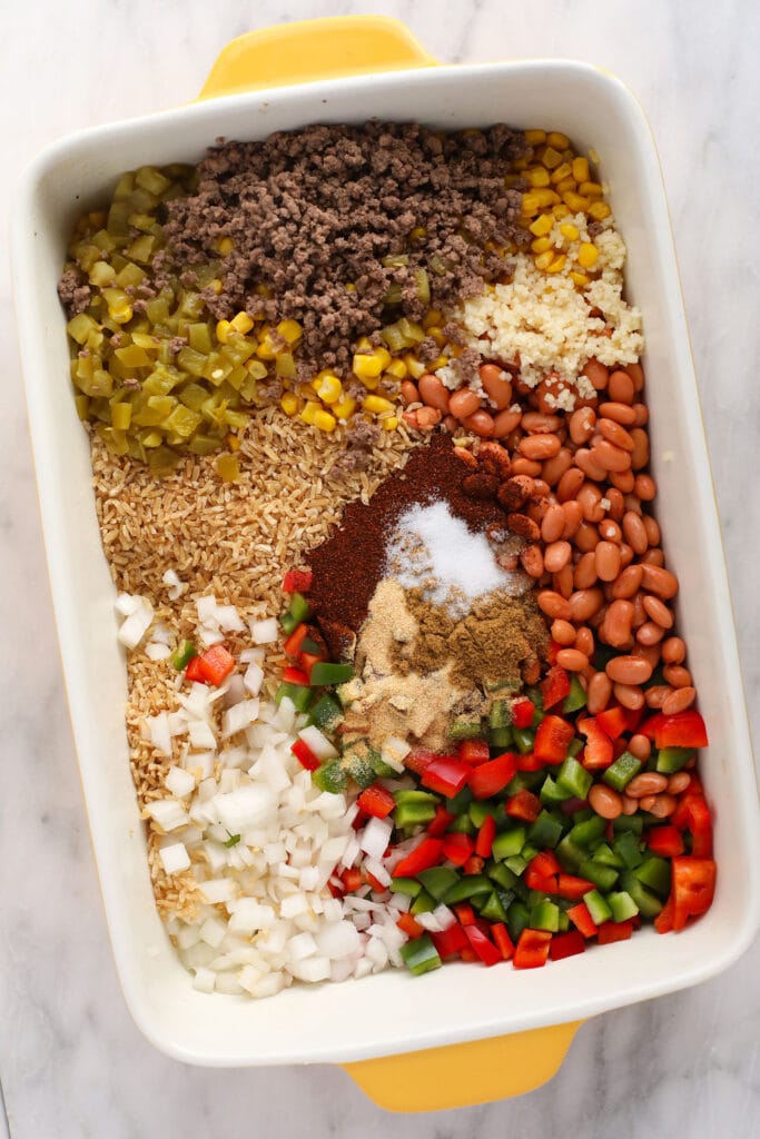 All the ingredients for an easy Mexican casserole in a casserole dish.