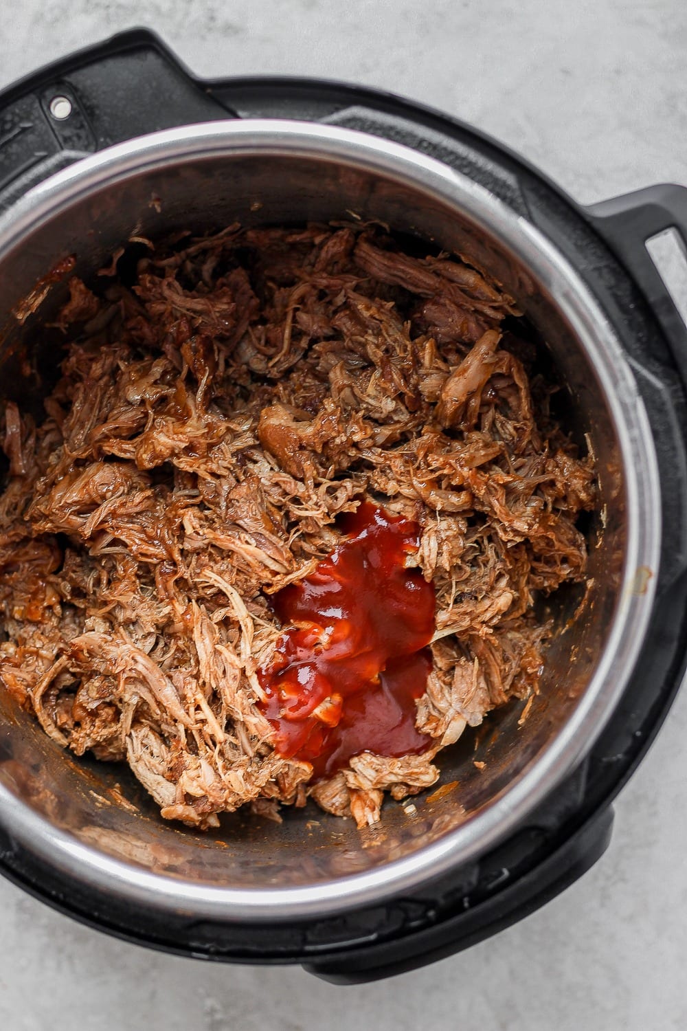 The most tender and juicy Instant Pot Pulled Pork made with a delicious dry rub and your favorite bbq sauce! easy instant pot pulled pork with bbq sauce