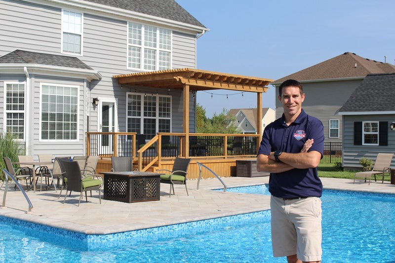 Pool Scouts - Man standing in front of a pool.