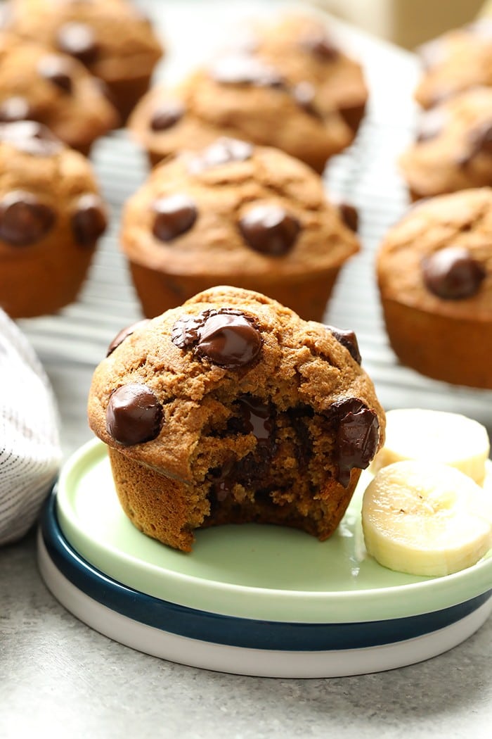 Looking for a healthy banana muffin recipe? This is it! Make a batch of these Healthy Banana Chocolate Chip Muffins for a yummy afternoon pick-me-up all week. banana chocolate chip muffin on a plate