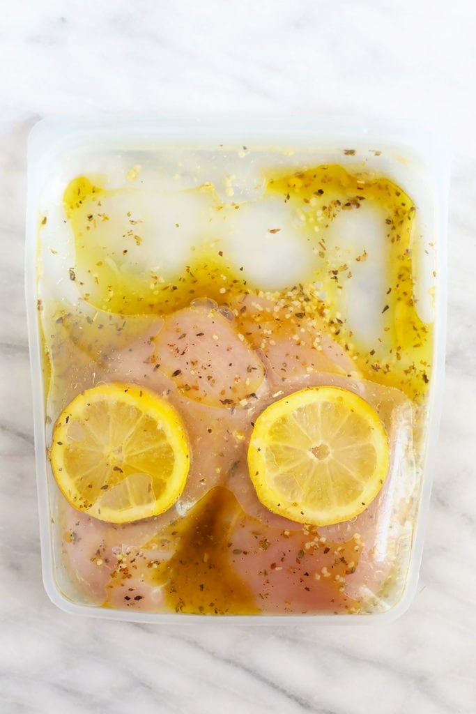 chicken marinating in Stasher bag with lemon