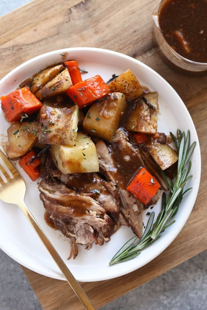 When in doubt, make a pork roast! This Instant Pot Pork Roast recipe has saved the day multiple times when I’ve been in a pinch. pork roast with veggies on plate