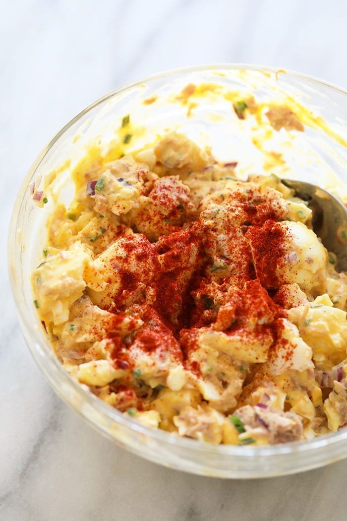 Tuna Salad with egg takes classic tuna salad up a natch by adding in hard-boiled eggs. This tuna salad recipe with egg whips up in no time and it's healthy! tuna egg salad mixed in a bowl